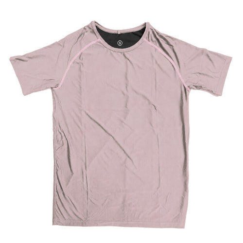 Man in a zero tee walking through tall grass.