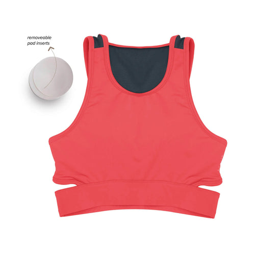 Women wearing a green Athlos Mid Intensity bra with a neutral background