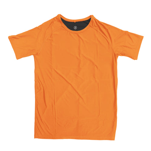 Man in a zero tee walking through tall grass.