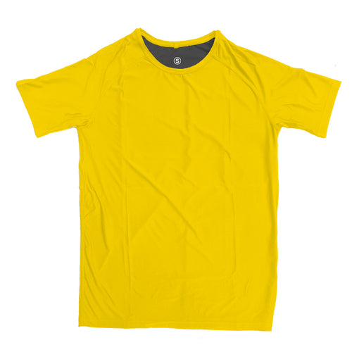 Man in a zero tee walking through tall grass.