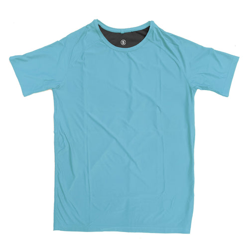 Man in a zero tee walking through tall grass.