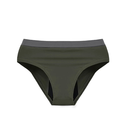 Person in a Athlos bra and Athlos Period underwear sitting on the floor with a bag.