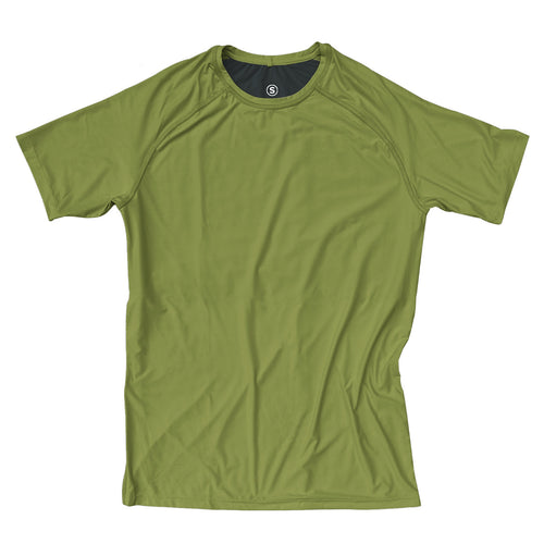 Man in a zero tee walking through tall grass.
