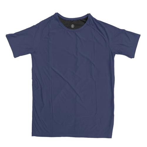 Man in a zero tee walking through tall grass.